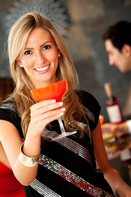 Woman Drinking Festive Cocktail at Party