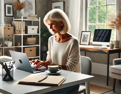 Woman Typing on Computer at Desk